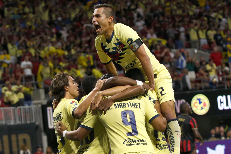 Club America celebrates a goal in the first half of the Campeones Cup soccer match against Atlanta United on Wednesday, Aug. 14, 2019, in Atlanta. (AP Photo/John Bazemore)