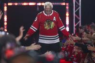 FILE - Former Chicago Blackhawks player Bobby Hull is introduced to fans during the NHL hockey team's convention in Chicago, July 26, 2019. Hull, a Hall of Fame forward who helped the Blackhawks win the 1961 Stanley Cup Final, has died. He was 84. The Blackhawks and the NHL Alumni Association announced the death of the two-time NHL MVP on Monday, Jan. 30, 2023. (AP Photo/Amr Alfiky, file)