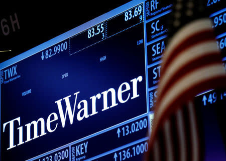 Ticker and trading information for media conglomerate Time Warner Inc. is displayed at the post where it is traded on the floor of the New York Stock Exchange (NYSE) in New York City, U.S., October 21, 2016. REUTERS/Brendan McDermid