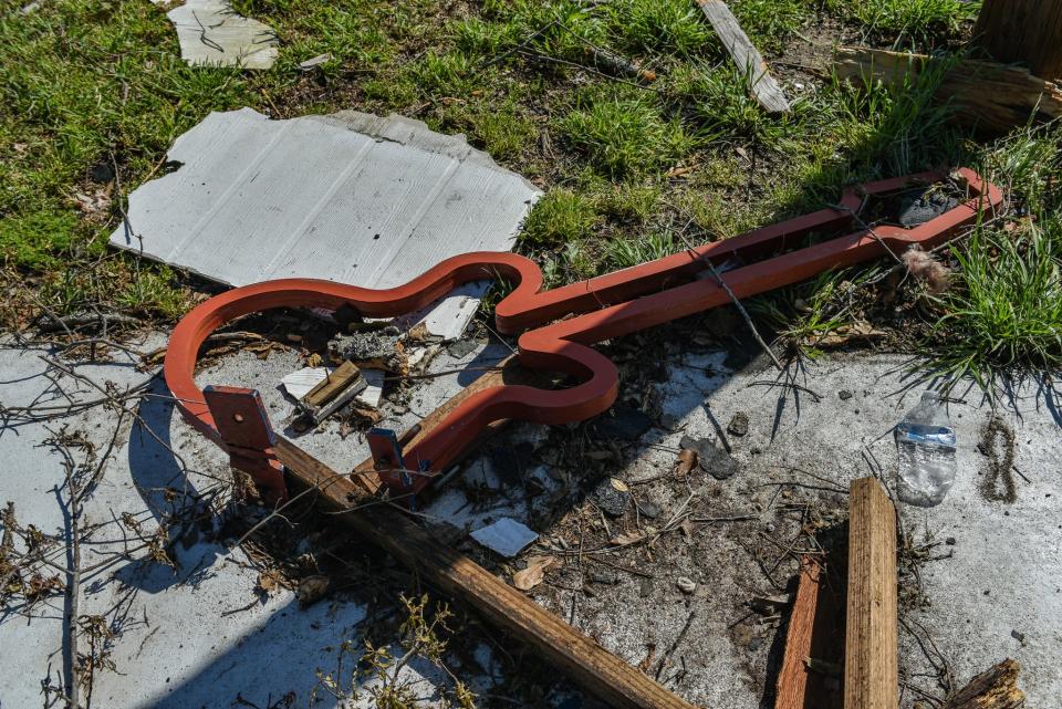 An empty frame which once held one of Muddy Waters' autographed guitars is seen following Friday's violent tornado in downtown Rolling Fork.