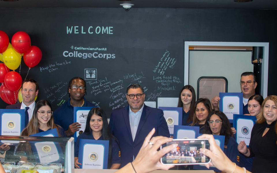 State and college leaders celebrate the food pantry opening with #CaliforniansForAll College Corps members.