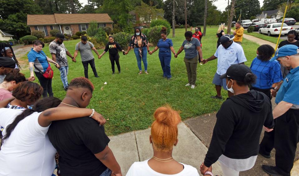 Parents gather in prayer after a Sept. 1 shooting at Mount Tabor High School in Winston-Salem, N.C., that left one student dead.