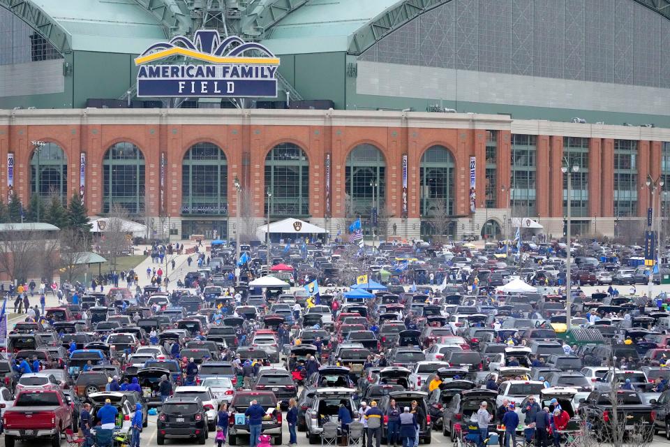 Brewers fans tailgate before the team's home opener against the New York Mets April 3 at American Family Field. Parking lots for games typically open three hours before first pitch.
