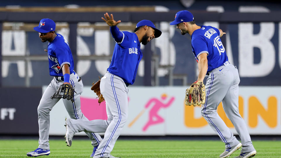 NEW YORK, NY - SEPTEMBER 07: (L-R) Outfielders Jarrod Dyson #1, Teoscar Hernandez #37 and Randal Grichuk #15 of the Toronto Blue Jays celebrate after defeating the New York Yankees 5-1 in a game at Yankee Stadium on September 7, 2021 in New York City. (Photo by Rich Schultz/Getty Images)