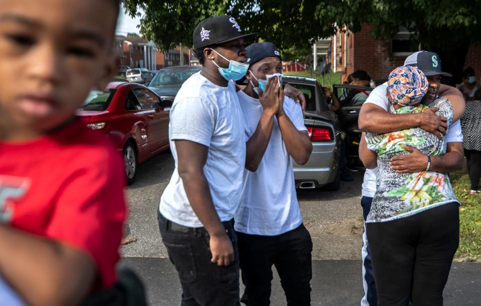 Balloons are released for the late LaQuantae Jackson who died in an alley behind a shuttered apartment building in the Taylor Berry neighborhood of Louisville. Oct. 1, 2021