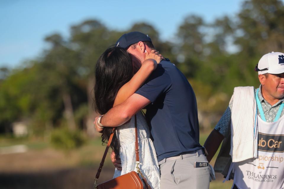 Former Georgia Southern golfer Steven Fisk gets a celebratory kiss from his wife Edith after winning the Korn Ferry Tour Club Car Championship at the Landings Club Deer Creek Course on Sunday, April 7, 2024.