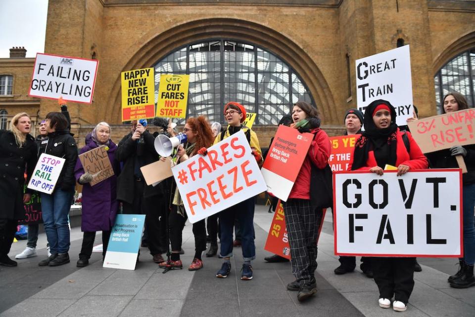 Protesters complain about train price rises outside King’s Cross (PA)