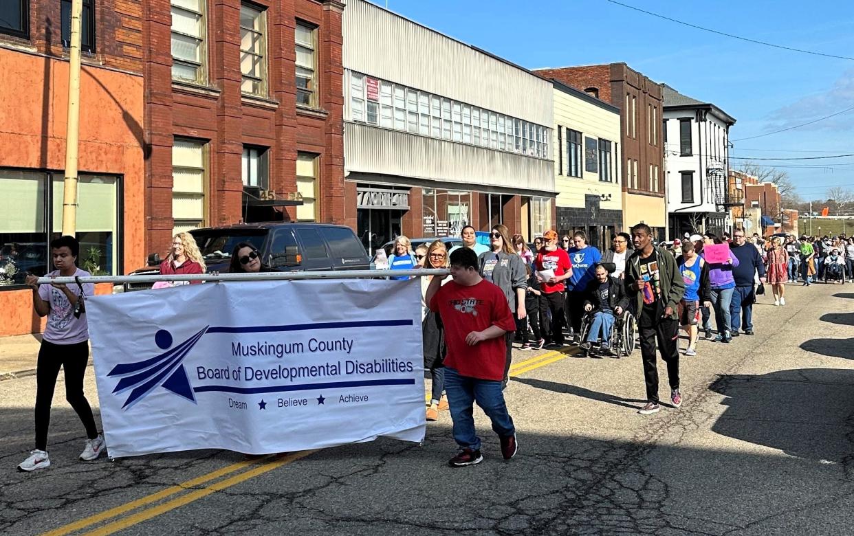 The Muskingum Board of Developmental Disabilities held a March for Inclusion on March 4 in Downtown Zanesville for Developmental Disability Month. There were nearly 200 participants with speakers at the Muskingum County Courthouse. Muskingum County Commissioners were also on hand to present a proclamation declaring March as DD Awareness Month in Muskingum County and encourage the community to learn more about developmental disabilities and explore ways to foster a more inclusive and supportive community.