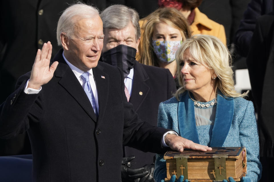 FILE - Joe Biden is sworn in as the 46th president of the United States by Chief Justice John Roberts as Jill Biden holds the Bible during the 59th Presidential Inauguration at the U.S. Capitol in Washington, Jan. 20, 2021. (AP Photo/Andrew Harnik, File)