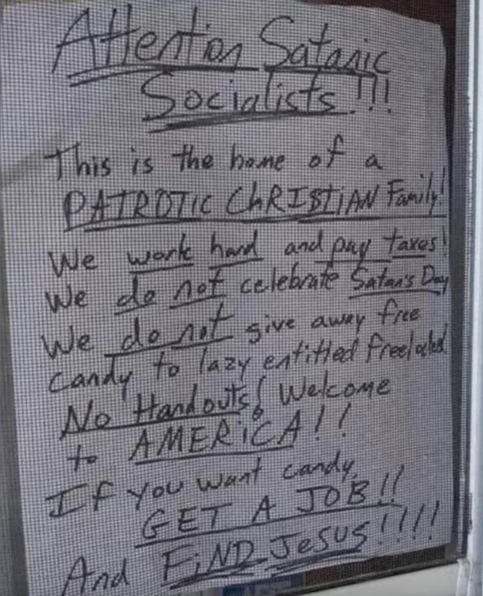 sign reading attention satanic socialists