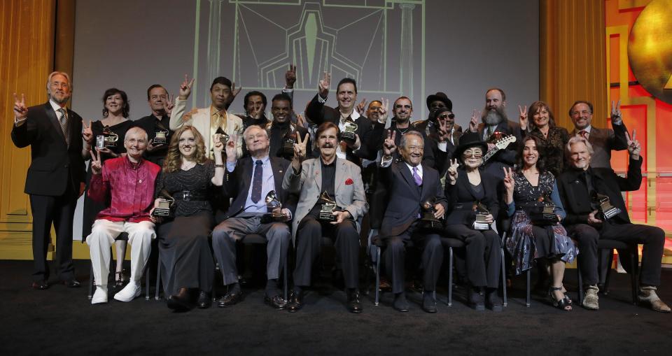 (Back L-R) Neil Portnow, Amelia Davis, Ralf Hutter, Chris Jasper, Ronald Isley, Andrea Morriconel, Ringo Starr, Ernie Isley, Kent Knappenberger and Christine Albert (Front L-R) Karen Shaffer, Rachel Barton Pine, Oliver Berliner, Rick Hall, Armando Manzanero, Yoko Ono, Olivia Harrison and Kris Kristofferson attend The 56th Annual GRAMMY Awards - Special Merit Awards Ceremony, on Saturday, January, 25, 2014 in Los Angeles. (Photo by Todd Williamson/Invision/AP)