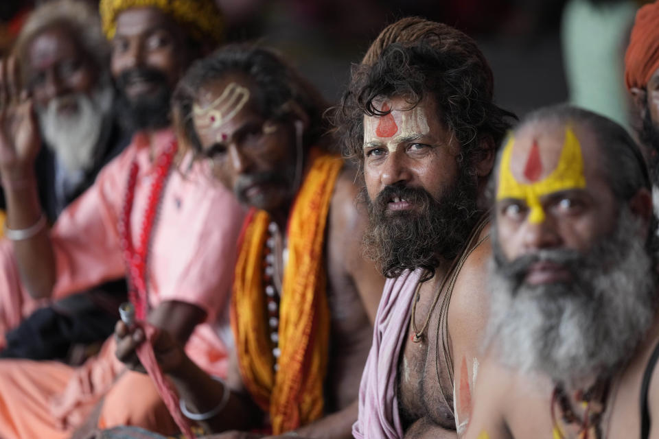 Hindu holy men wait to register for an annual pilgrimage to the holy Amarnath cave, in Jammu, India, Saturday, July 9, 2022. At least 13 people were killed when sudden rains triggered flash floods during an annual Hindu pilgrimage to an icy Himalayan cave in Indian-controlled Kashmir on Friday, police said. (AP Photo/Channi Anand)