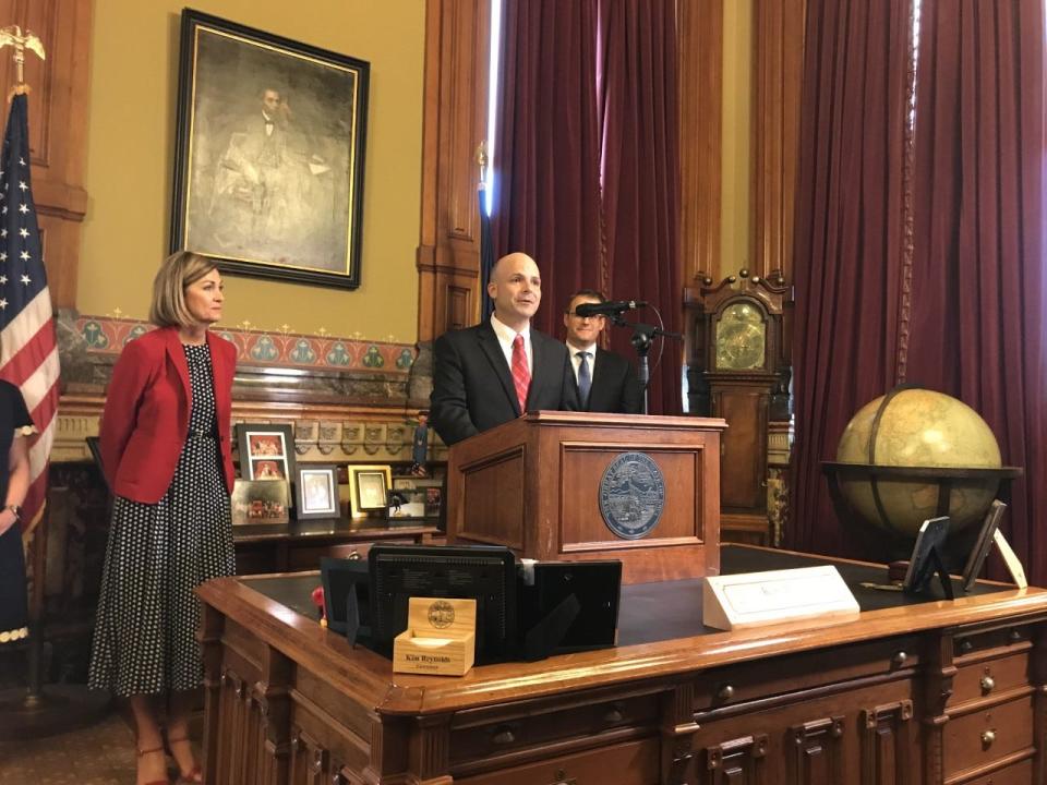 Gov. Kim Reynolds, left, named Judge David May, middle, to the Iowa Supreme Court on Wednesday.