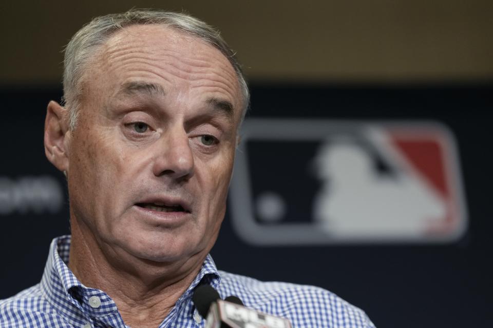 Major League Baseball Commissioner Robert Dean Manfred Jr. answers questions at spring training media day Wednesday, Feb. 15, 2023, in Phoenix. (AP Photo/Morry Gash)