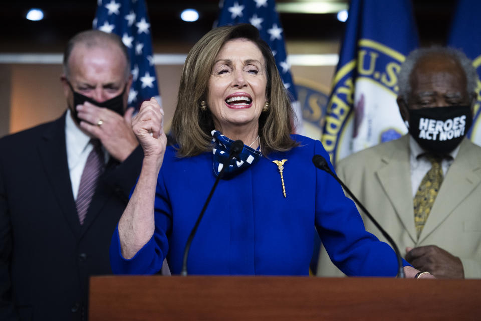 UNITED STATES - JULY 24: Speaker of the House Nancy Pelosi, D-Calif., tells a story about trying to call Rob Reiner, during a news conference to call for the extension of the federal unemployment insurance in the Capitol Visitor Center to on Friday, July 24, 2020. Reps. Danny Davis, D-Ill., right, and Dan Kildee, D-Mich., also appear. Pelosi dialed the wrong number when trying to call Reiner to offer condolences for his late father, Carl. (Photo By Tom Williams/CQ-Roll Call, Inc via Getty Images)