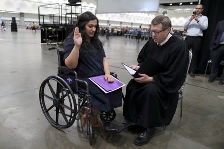 Tatev, who is from Armenia and has lived in the U.S. for 17 years and Judge Cormac J. Carney are seen during a quick impromptu naturalization ceremony before the official event in Los Angeles