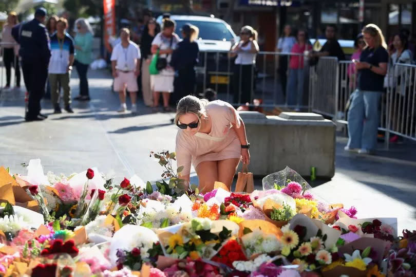 Members of the public lay floral tributes at Oxford Street Mall alongside Westfield Bondi Junction on April 14, 2024 in Australia