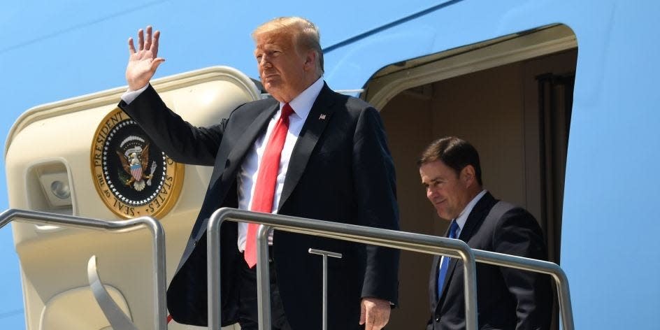 President Donald Trump (left) and Arizona Governor Doug Ducey disembark from Air Force One upon arrival in Phoenix, Arizona, on June 23, 2020.