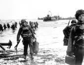 Carrying full equipment, American assault troops move onto a beachhead code-named Omaha Beach on the northern coast of France on June 6, 1944, during the Allied invasion of the Normandy coast. (Photo: AP)