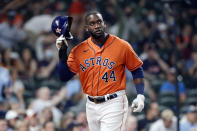 Houston Astros' Yordan Alvarez doffs his helmet after scoring on a single by Myles Straw against the Detroit Tigers during the second inning of a baseball game Tuesday, April 13, 2021, in Houston. (AP Photo/Michael Wyke)