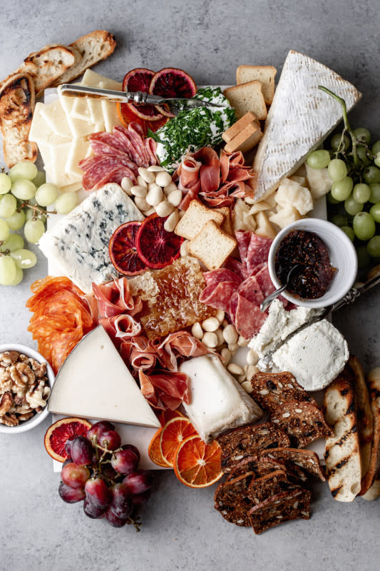 <p>Cooking with Cocktail Rings</p><p>Here's how to put together an epic cheese and charcuterie board!</p><p><strong>Get the recipe: <a href="https://www.cookingwithcocktailrings.com/events-holidays/2016/3/3/how-to-put-together-a-great-cheese-charcuterie-board" rel="nofollow noopener" target="_blank" data-ylk="slk:Cheese and Charcuterie Board;elm:context_link;itc:0;sec:content-canvas" class="link ">Cheese and Charcuterie Board</a></strong></p>