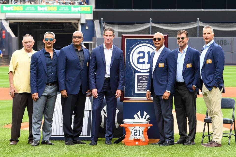 Aug 21, 2022; Bronx, New York, USA; New York Yankees former players Paul OÕNeil, Andy Pettitte, Mariano Rivera, Jorge Posada, Bernie Williams and Tino Martinez pose for a photo during a ceremony to retire the number of Paul OÕNeil before the game between the New York Yankees and Toronto Blue Jays at Yankee Stadium. Mandatory Credit: Dennis Schneidler-USA TODAY Sports