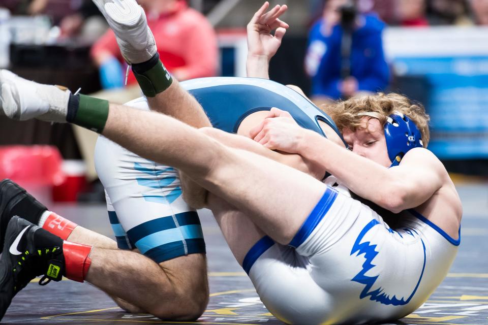 Conwell-Egan's Charlie Robson (bottom) wrestles Muncy's Scott Johnson in the 133-pound third-place bout at the PIAA Class 2A Wrestling Championships at the Giant Center on March 11, 2023, in Hershey. Johnson won by decision, 5-2.