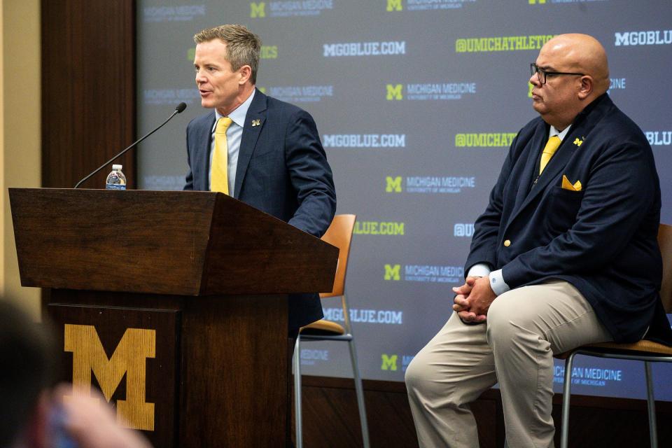 U-M's new men's basketball head coach Dusty May answers a question next to athletic director Warde Manuel speaks during an introductory press conference at Junge Family Champions Center in Ann Arbor on Tuesday, March 26, 2024.