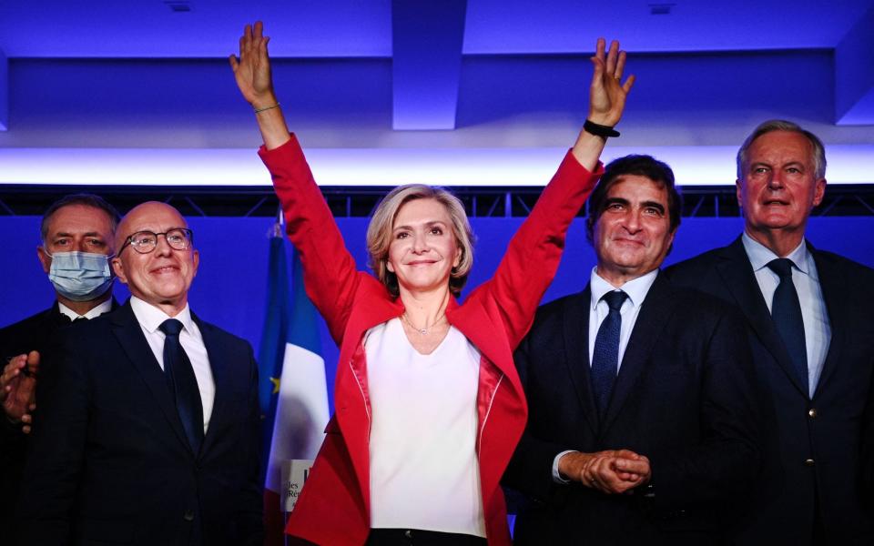 Valerie Pecresse celebrates after winning the nomination ahead of candidates including Michel Barnier (right) - Getty Images