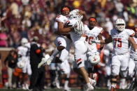 Bowling Green punter Matt Naranjo (96) celebrates with teammate cornerback Jalen Burton after winning 14-10 against Minnesota during an NCAA college football game Saturday, Sept. 25, 2021, in Minneapolis. (AP Photo/Stacy Bengs)