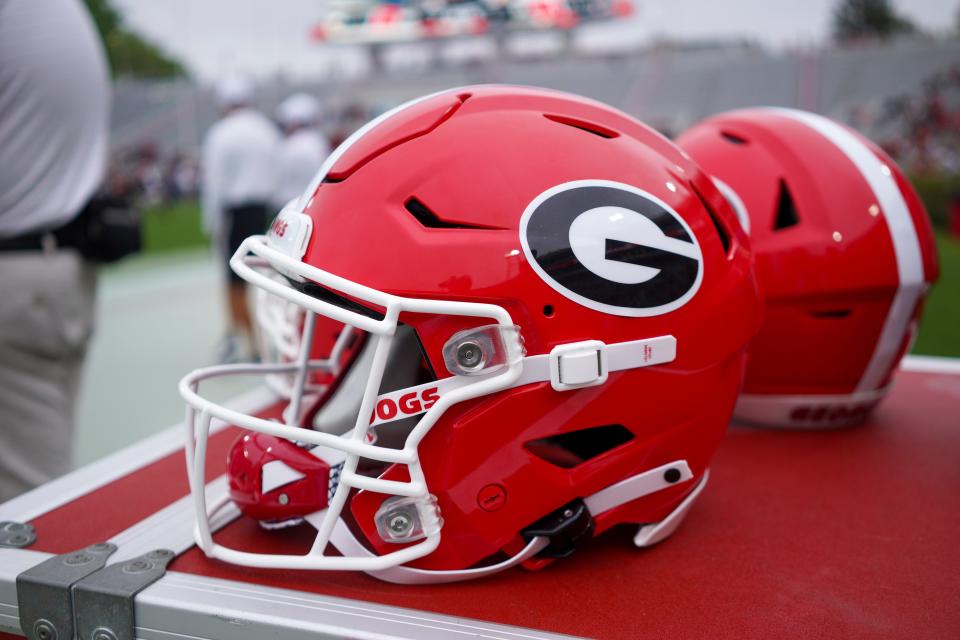 Georgia helmet on the sideline before Georgia's spring NCAA college football game, Saturday, April 16, 2022, in Athens, Ga. (AP Photo/Brett Davis)