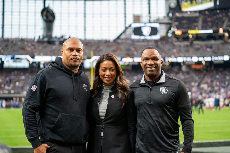 Las Vegas Raiders interim head coach Antonio Pierce, president Sandra Douglass Morgan, and interim general manager Champ Kelly pose for a photo before the game against the New York Giants at Allegiant Stadium.