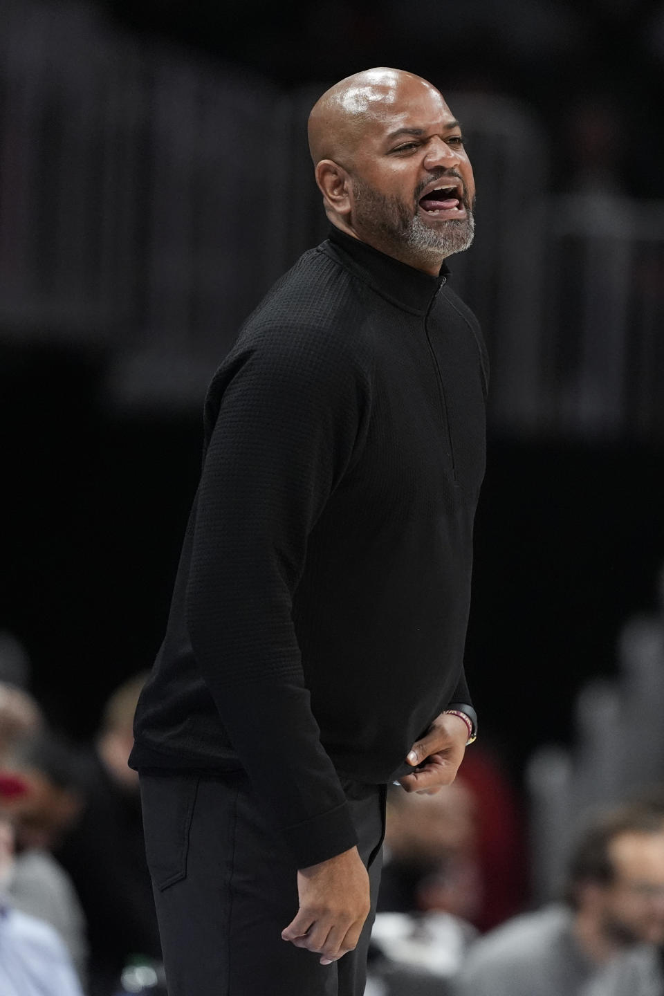 Cleveland Cavaliers head coach J.B. Bickerstaff yells to his players on the floor during the first half of an NBA basketball game against the Atlanta Hawks Wednesday, March 6, 2024, in Atlanta. (AP Photo/John Bazemore)