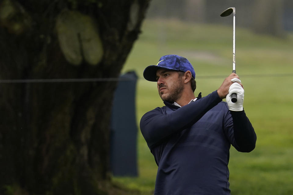 Brooks Koepka hits toward a green during practice for the PGA Championship golf tournament at TPC Harding Park in San Francisco, Tuesday, Aug. 4, 2020. (AP Photo/Jeff Chiu)