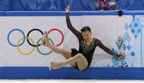 South Korea's Kim Hae-jin falls during the figure skating women's free skating program at the 2014 Sochi Winter Olympics, February 20, 2014. REUTERS/Alexander Demianchuk (RUSSIA - Tags: OLYMPICS SPORT FIGURE SKATING)