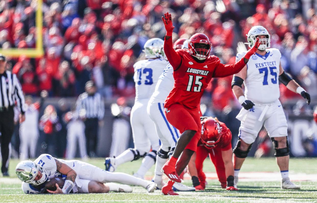Louisville Cardinals defensive lineman Kameron Wilson (15) celebrates after sacking Kentucky Wildcats quarterback Devin Leary (13) in the first half last November. Wilson has transferred to UC.