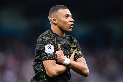 <span class="caption">Kylian Mbappé celebrating a goal with his trademark celebration. </span> <span class="attribution"><a class="link " href="https://www.shutterstock.com/image-photo/kylian-mbappe-celebrates-goal-after-scoring-2313795107" rel="nofollow noopener" target="_blank" data-ylk="slk:Victor Velter/Shutterstock;elm:context_link;itc:0;sec:content-canvas">Victor Velter/Shutterstock</a></span>