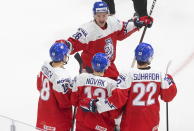 Czech Republic's David Vitouch (18), Pavel Novak (13), Jiri Suhrada (22) and Adam Raska (26) celebrate a goal against Austria during the second period of an IIHF World Junior Hockey Championship game, Thursday, Dec. 31, 2020 in Edmonton, Alberta. (Jason Franson/The Canadian Press via AP)