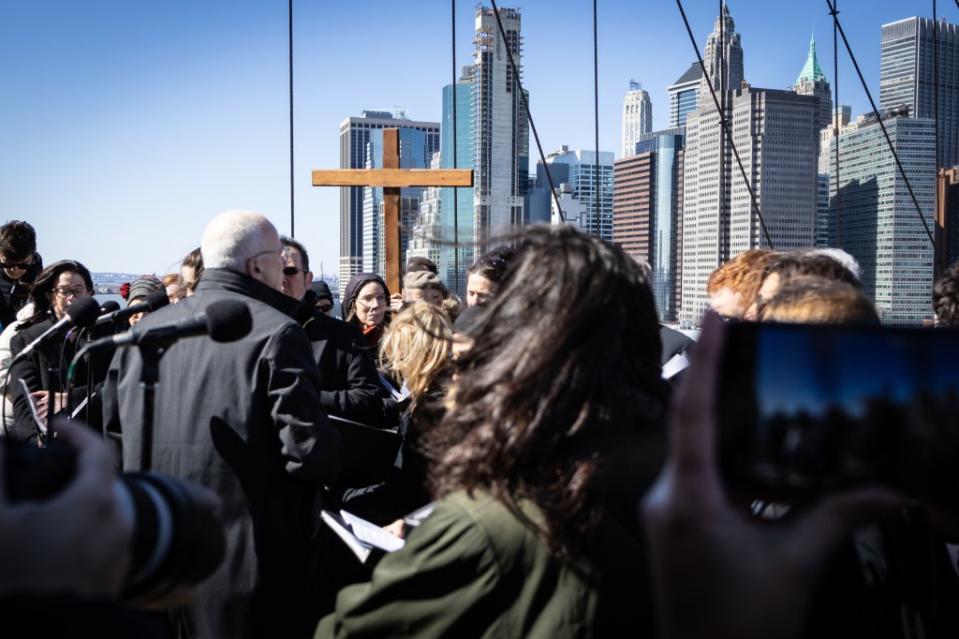 A group of people participating in the Way of the Cross procession over the Brooklyn Bridge on Friday. Stefan Jeremiah for NY Post