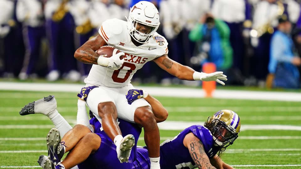 Texas Longhorns tight end Ja'Tavion Sanders  runs with the ball during the second quarter against the Washington Huskies in the 2024 Sugar Bowl college football playoff semifinal game. - John David Mercer/USA Today Network/Reuters