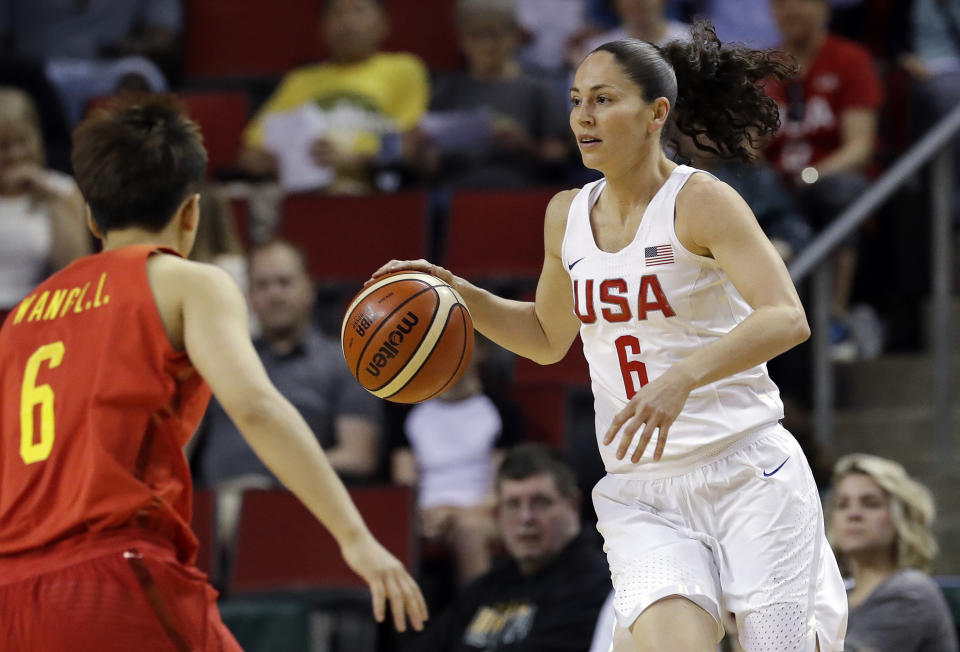 In this April 26, 2018, file photo, United States’ Sue Bird, right, dribbles against China during the first half of an exhibition game in Seattle. Bird is on a record fifth U.S. women’s basketball World Cup team. (AP Photo/Elaine Thompson, File)