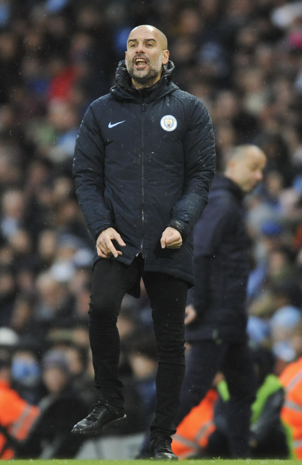 Manchester City manager Josep Guardiola reacts during the FA Cup 4th round soccer match between Manchester City and Burnley at Etihad stadium in Manchester, England, Saturday, Jan. 26, 2019. (AP Photo/Rui Vieira)