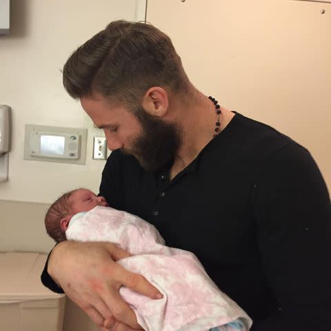 <p>Julian Edelman Instagram</p> Julian Edelman with his newborn daughter Lily in December 2023