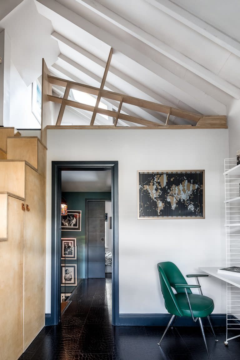 Converted loft bedroom with plywood stairs