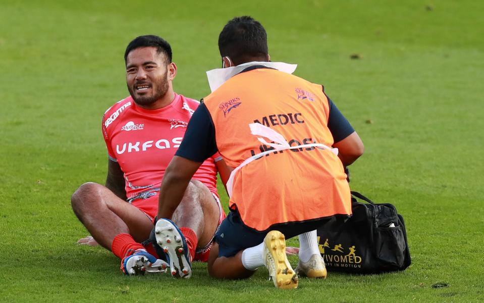 Manu Tuilagi of Sale Sharks receives attention to an injured left leg and is replaced during the Gallagher Premiership Rugby match between Northampton Saints and Sale Sharks - Getty Images