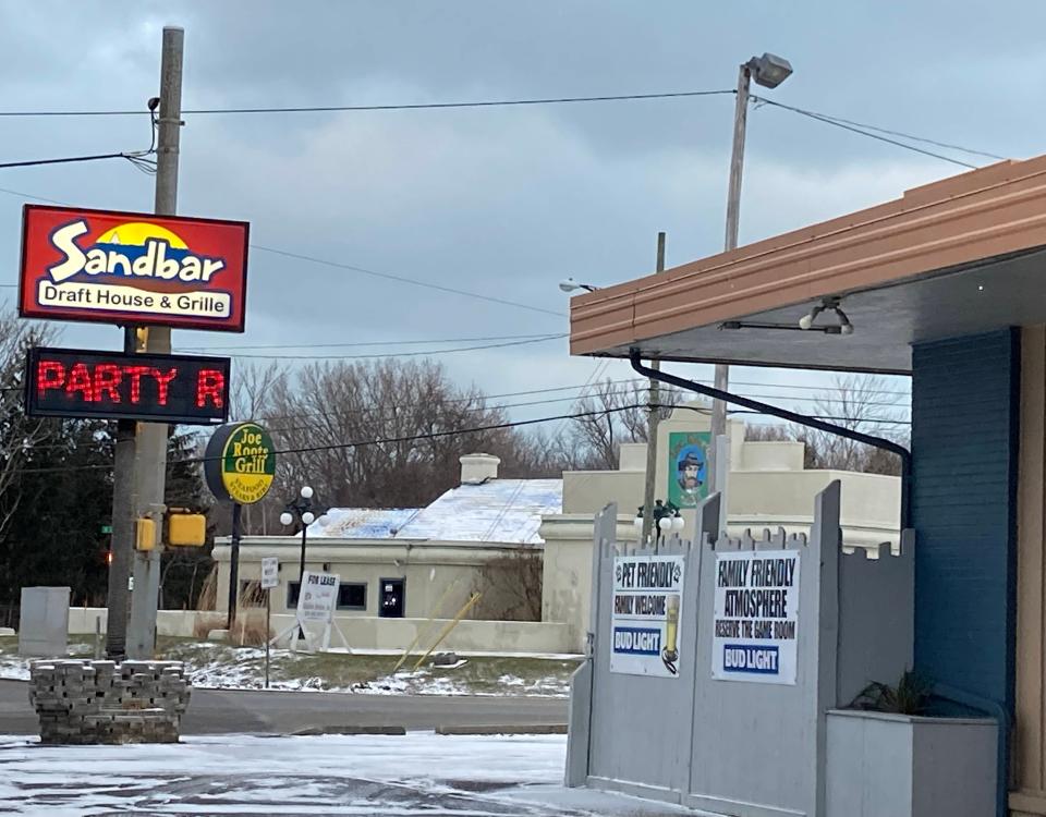 Millcreek Township is buying the former Joe Root's Grill and the Sandbar restaurant and bar to develop the area at West Eighth Street and Peninsula Drive, shown here on Jan, 31. The township is also buying the Manor Motel, next to the Sandbar to the east, and the former Bel-Aire Motel, to the east of Joe Root's.