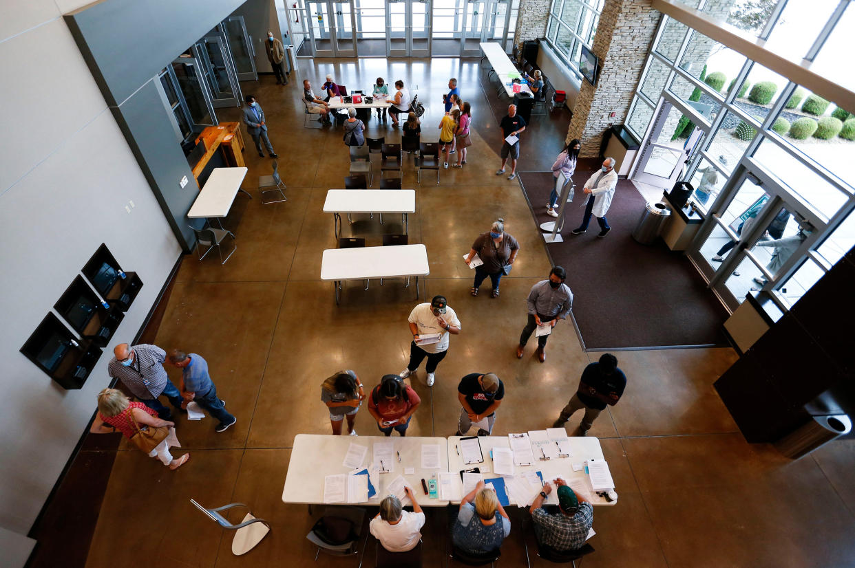 Image: People line up to receive Covid-19 vaccines at the James River Church West Campus in Springfield, Mo. during a vaccine clinic put on by Jordan Valley Community Health Center on July 12, 2021. (Nathan Papes / Springfield News-Leader / USA Today Network)