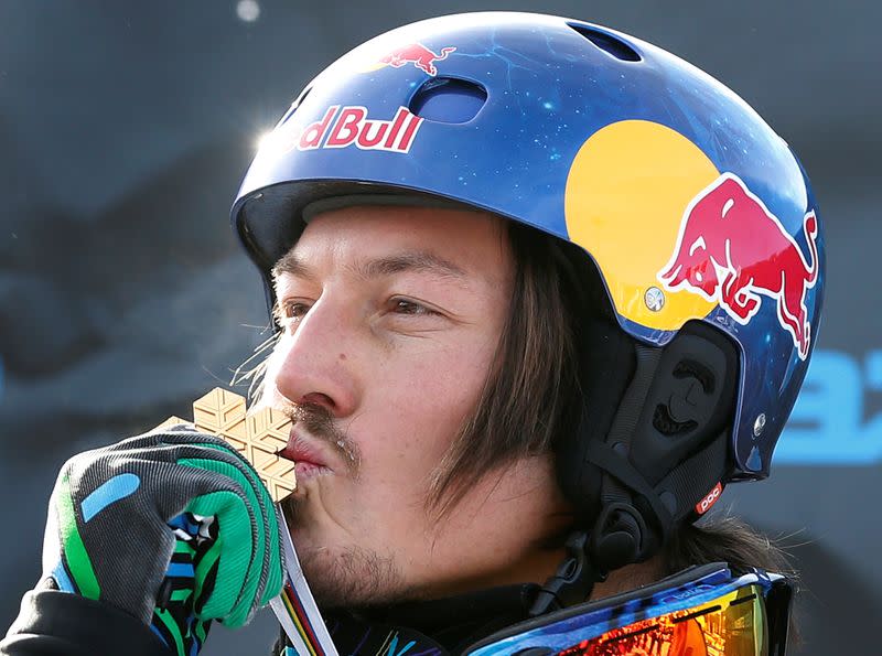 FILE PHOTO: Australia's Pullin kisses his medal on the podium after the men's snowboard-Cross finals at the FIS Snowboard World Championships in Stoneham