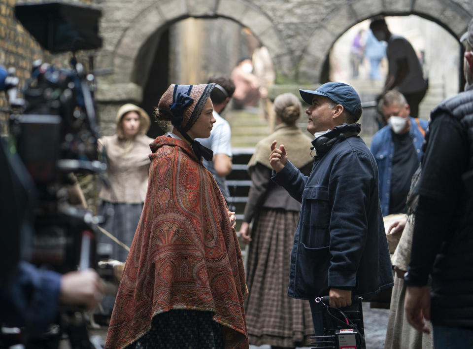 This image released by Netflix shows writer-director Sebastián Lelio, right, and Florence Pugh on the set of "The Wonder." (Aidan Monaghan/Netflix via AP)