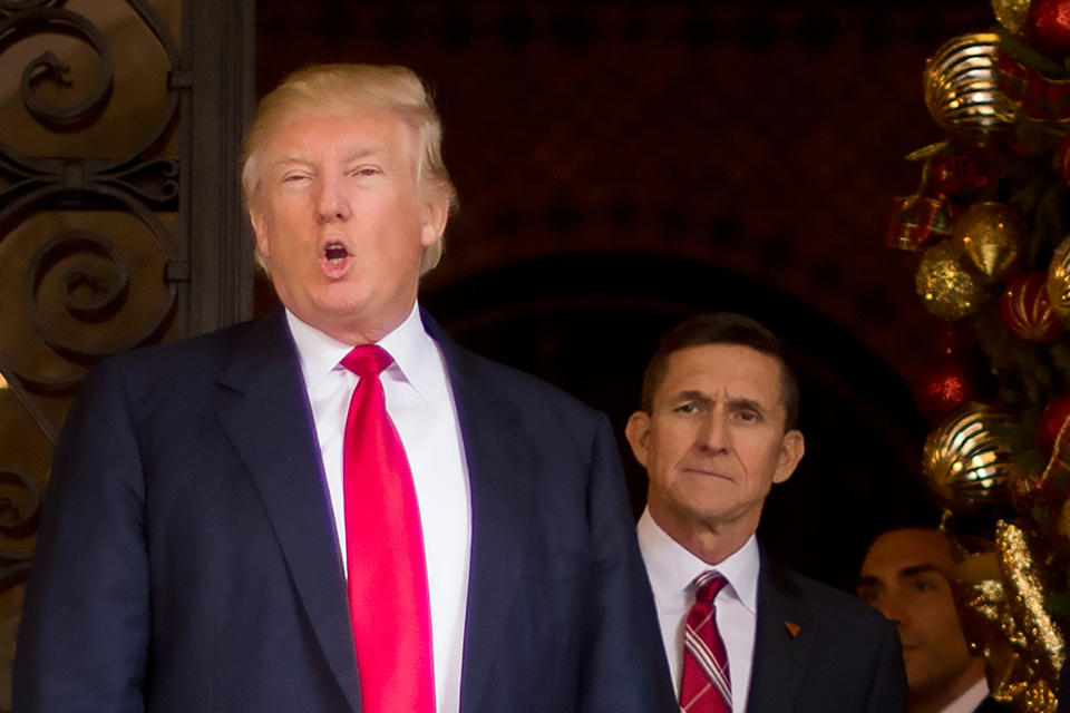 Donald Trump (L) with his former national security advisor Michael Flynn.